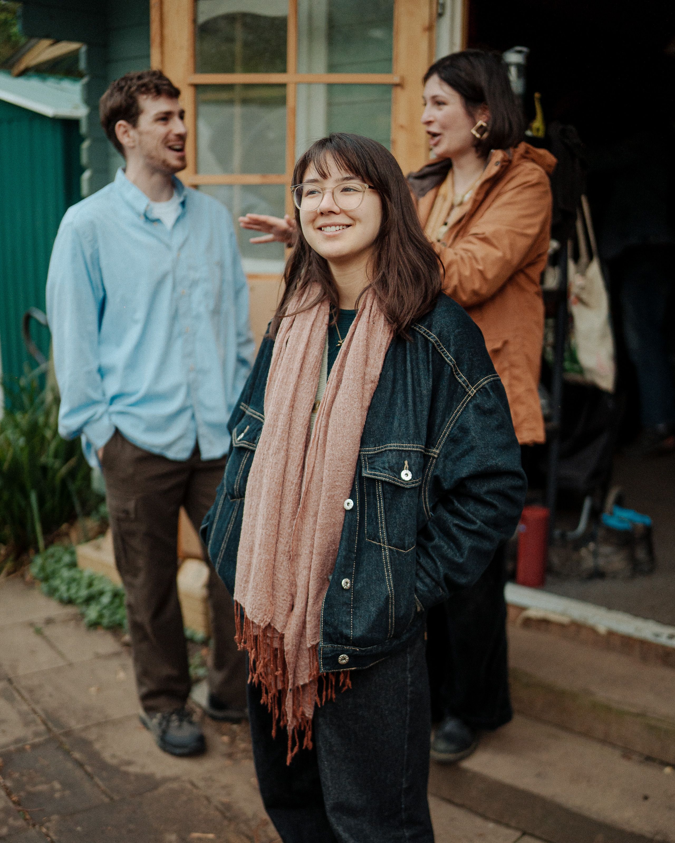 Group standing in front of shed